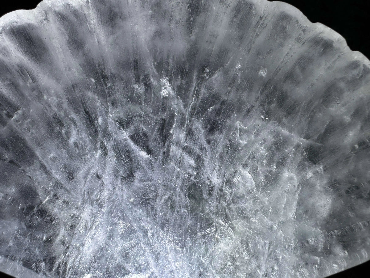 Close up Clear Quartz carved bowl Bowl shaped like a Sea Shell