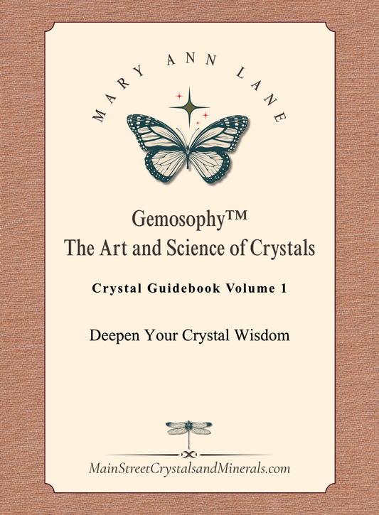 Crystal guidebook cover with butterfly design and text on a beige background