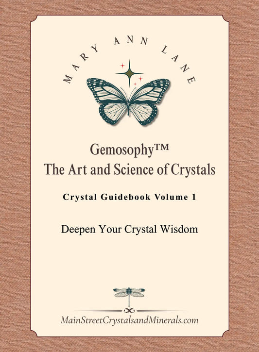 Crystal guidebook cover with butterfly design and text on a beige background