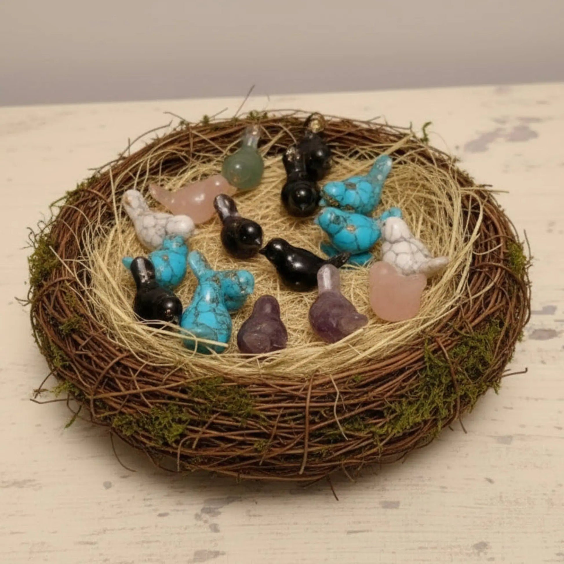 Opalite birds in a cute nest several materials like, black obsidian, turquoise, amethyst, orgone orgonite