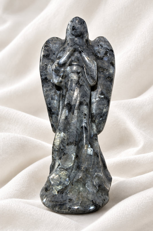 photo of larvikite hand carved angel. shows amazing detail and schiller