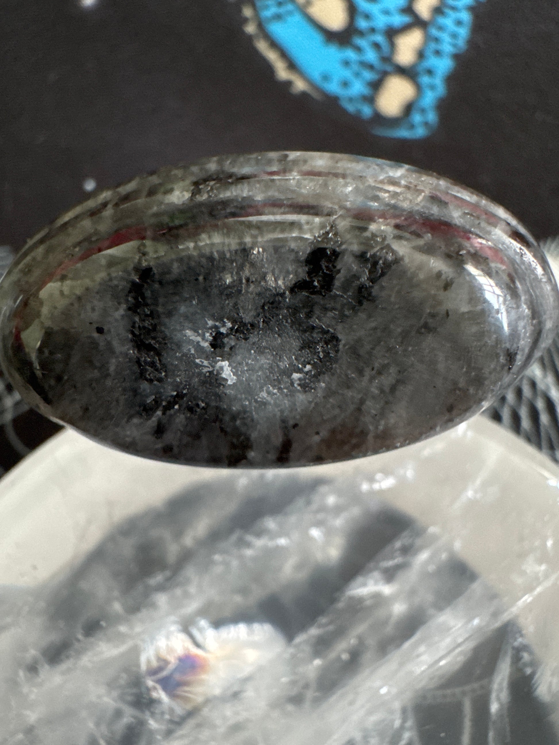 Oval gray and black crystal.