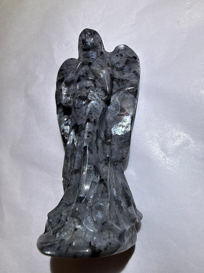 photo of larvikite hand carved angel with obvious silvery blue shimmering flash