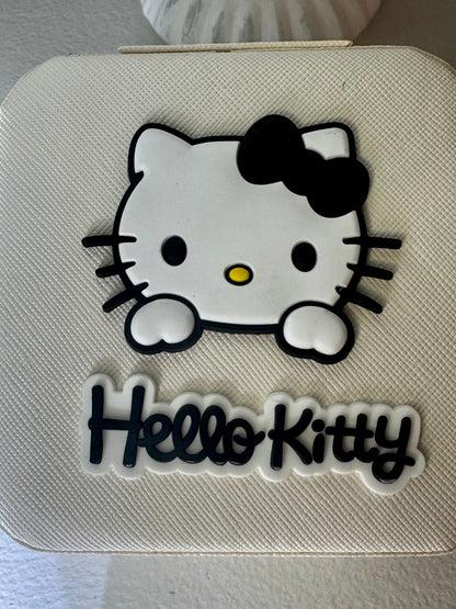 Close-up of a white case with Hello Kitty design.