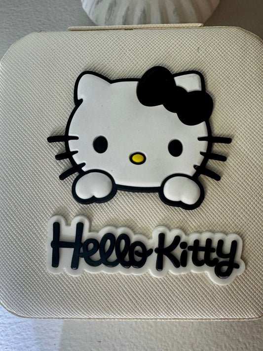 Close-up of a white case with Hello Kitty design.