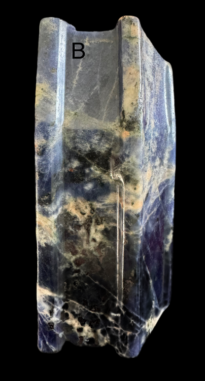 Polished sodalite with white veining and letter "B."
