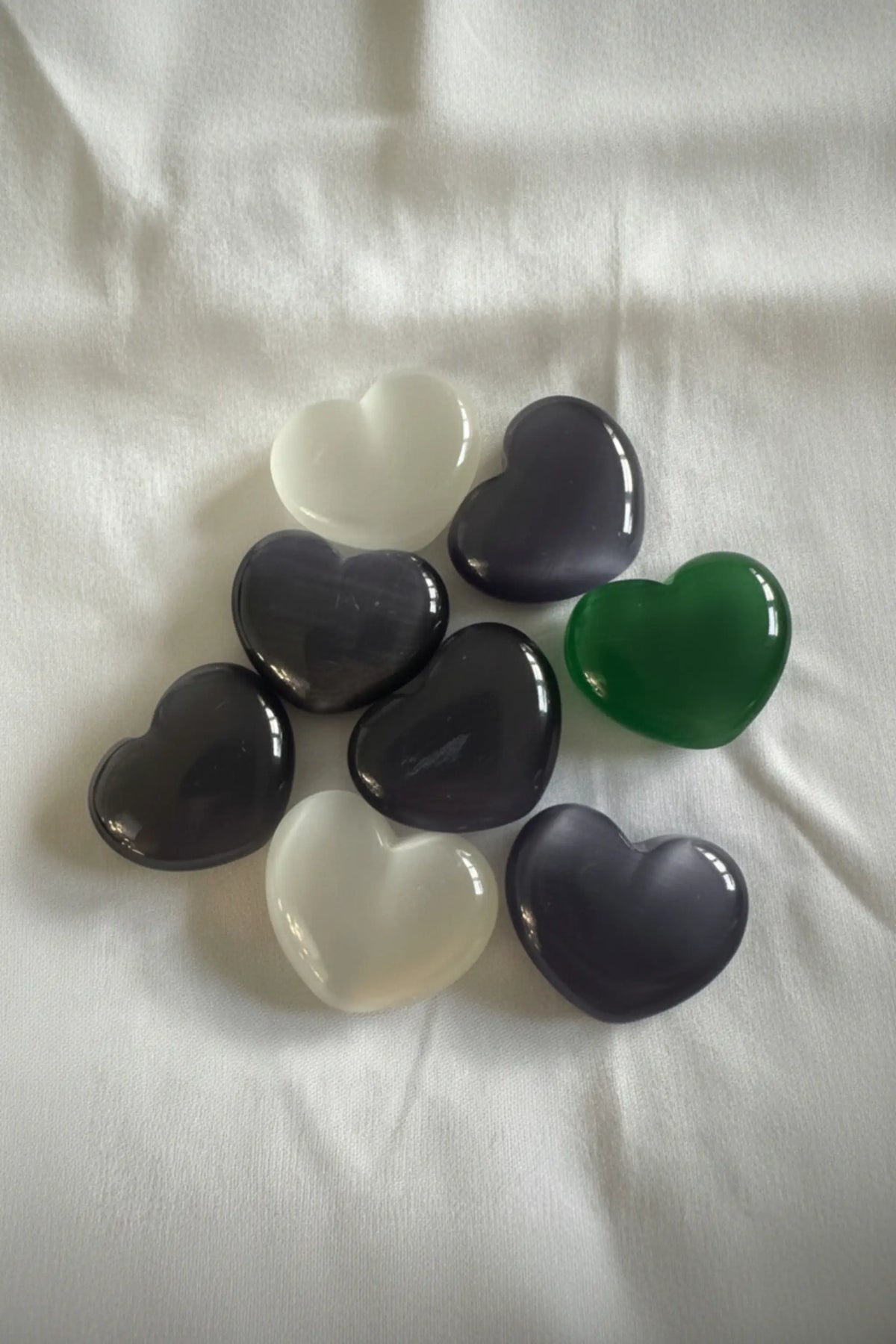 Chatoyant Selenite carved hearts different colors white, purple, green and blue