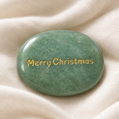 green aventurine carved worry stone, oval shape with gold tone lettering Merry Christmas on one side