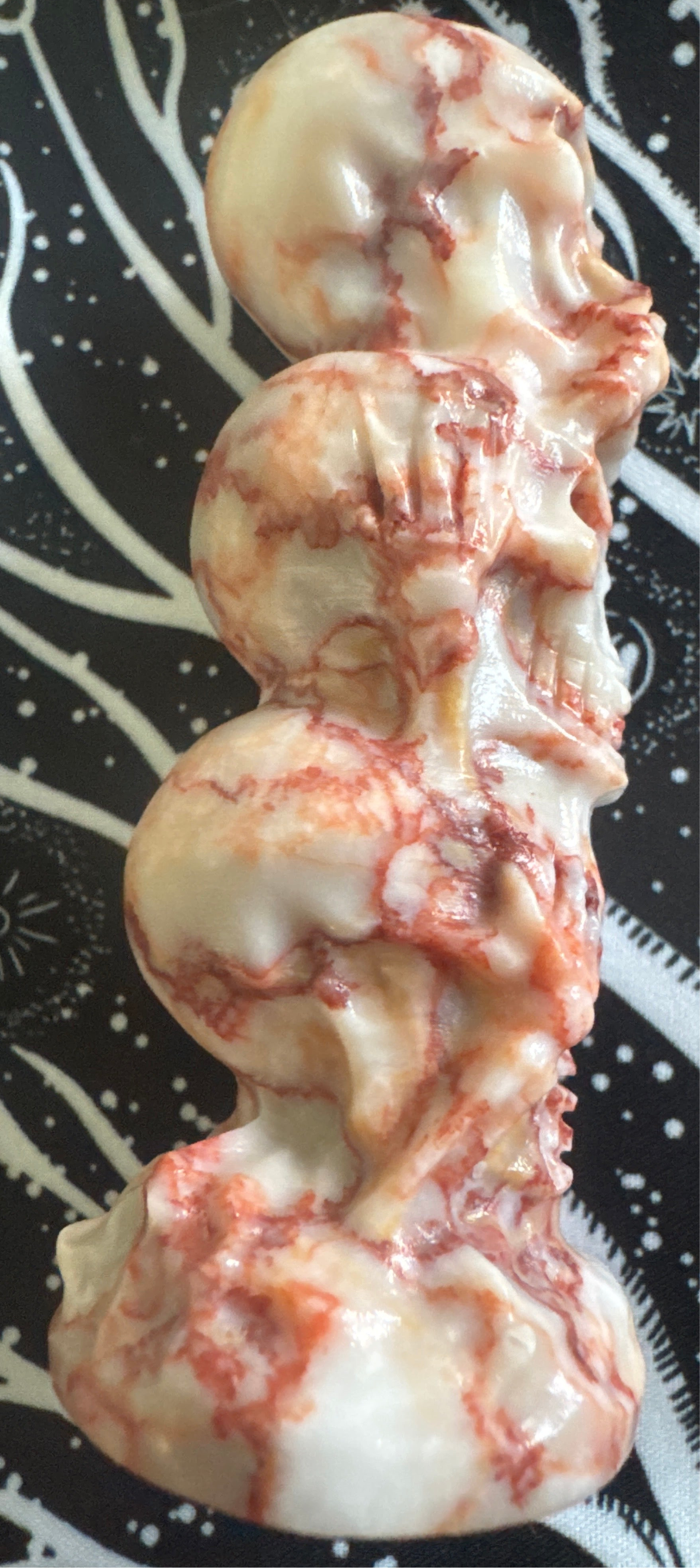 Carved stack of marble skulls.