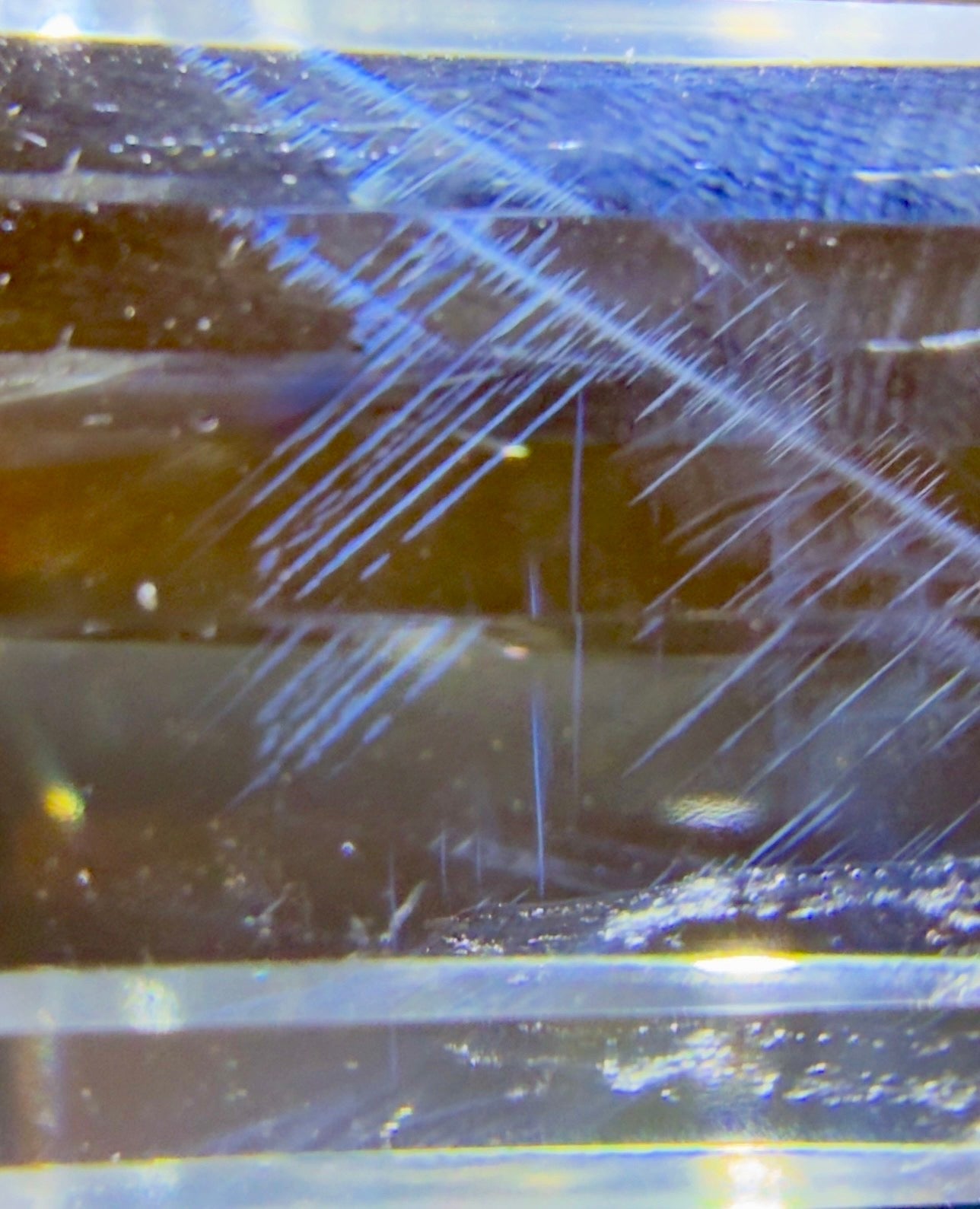 Clear Quartz double point side view with Blue Tyndall inclusion