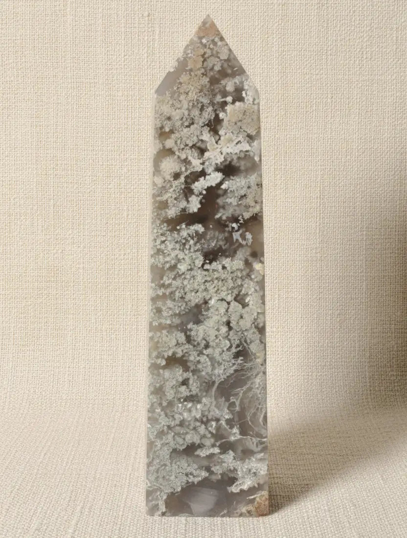 front view of flower agate tower four sides. beautiful light green mossy and dark green inclusions