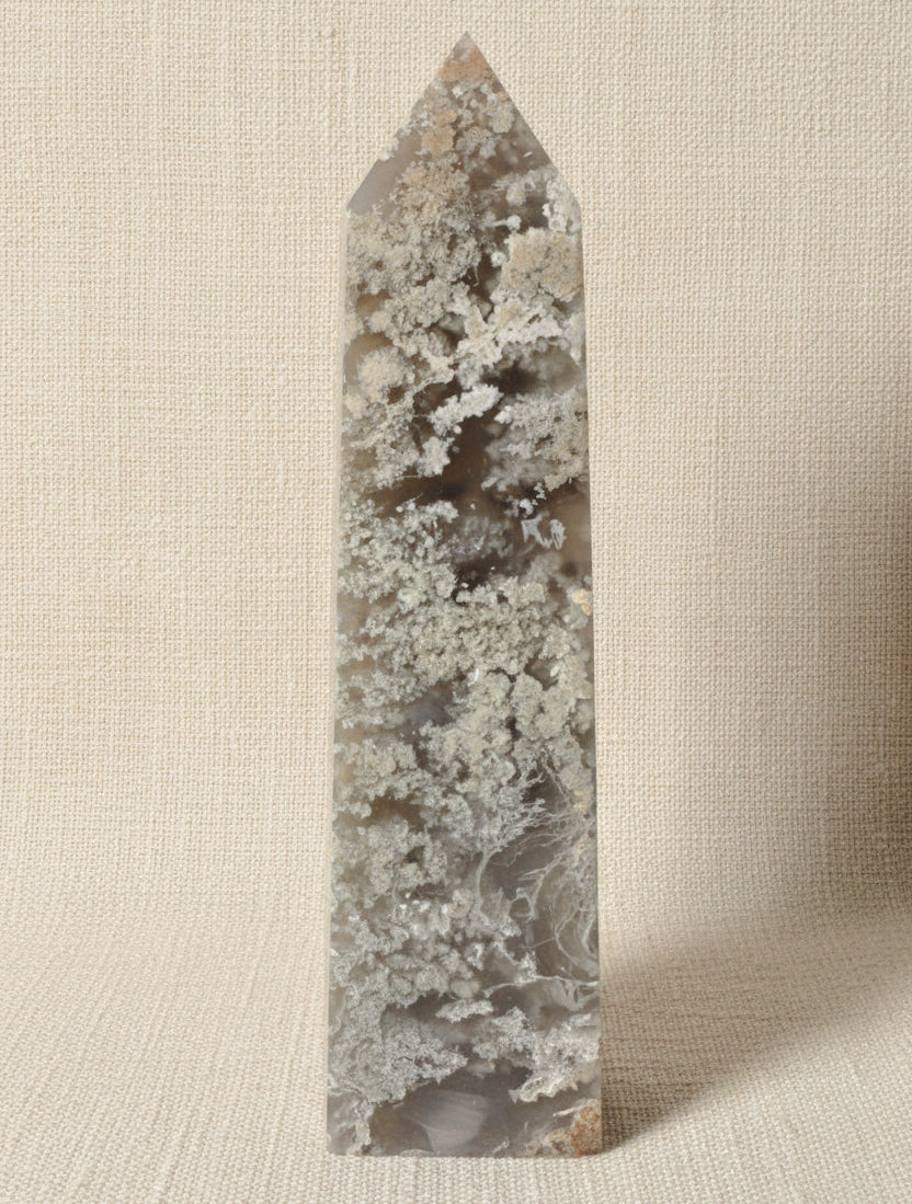 front view of flower agate tower four sides. beautiful light green mossy and dark green inclusions