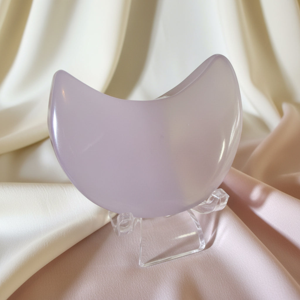 close-up fluorite crescent moon on a clear stand