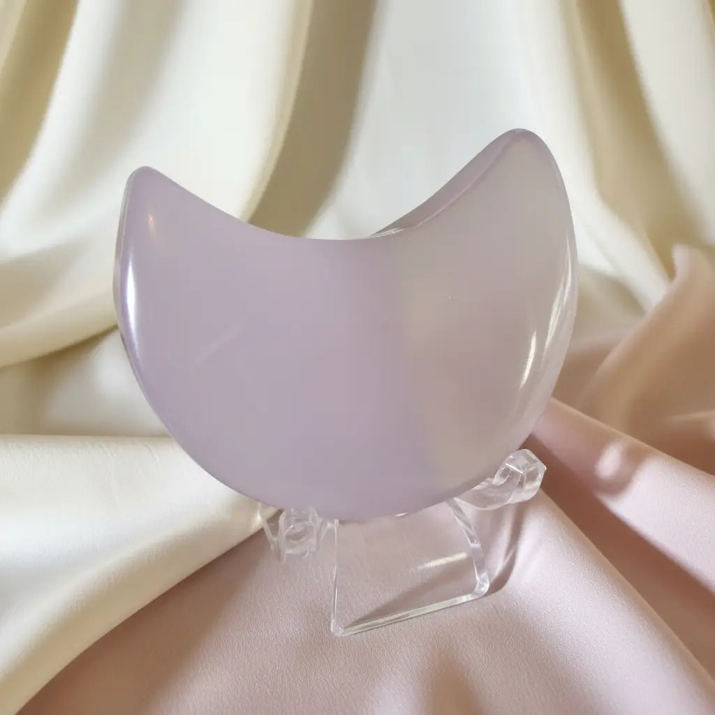close-up fluorite crescent moon on a clear stand