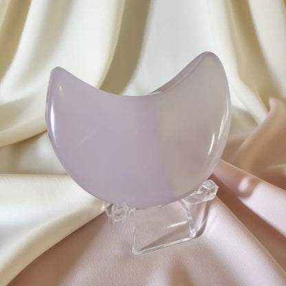 close-up fluorite crescent moon on a clear stand