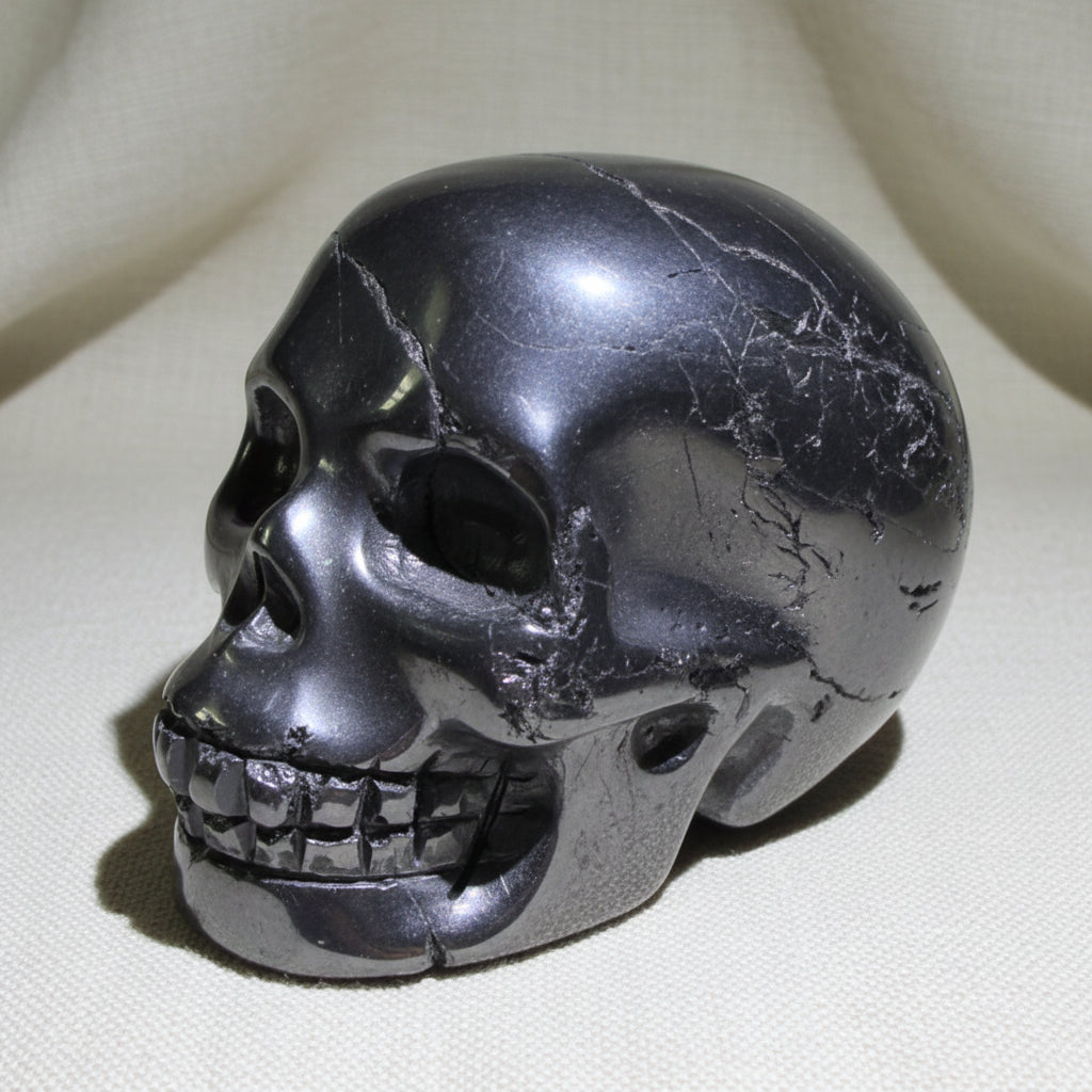 Close up of hematite skull some polished some still raw mineral 
