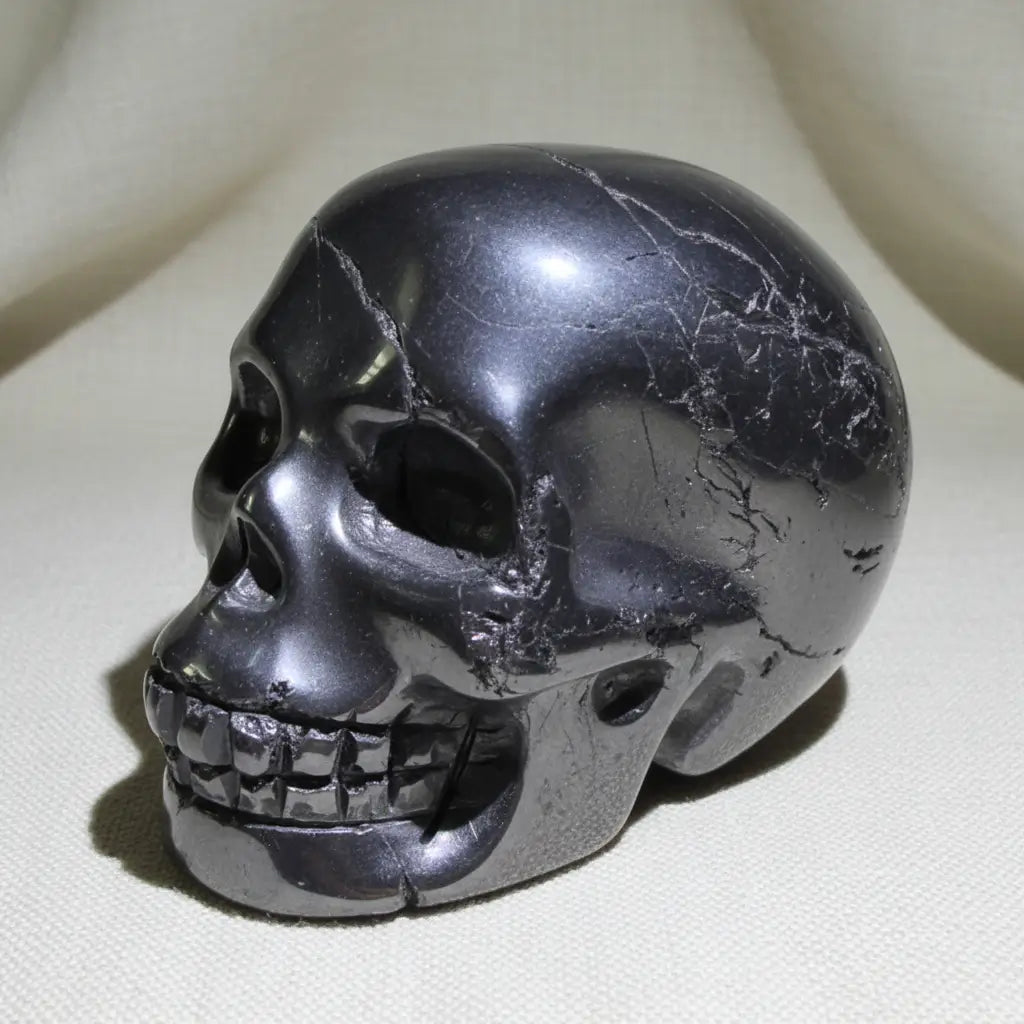 Close up of hematite skull some polished some still raw mineral 