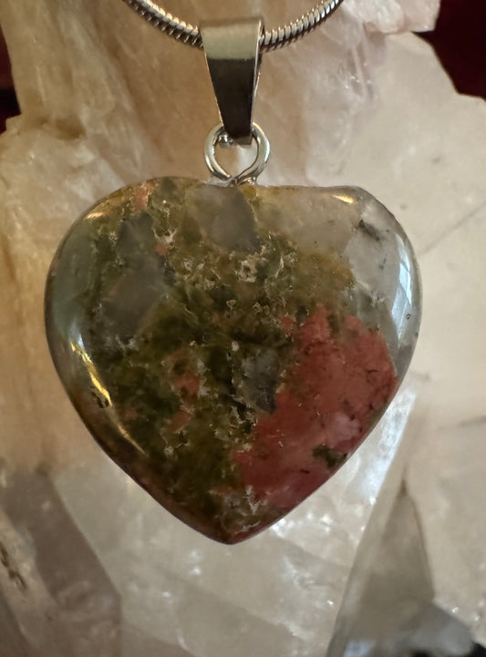 Heart-shaped unakite pendant on silver chain.
