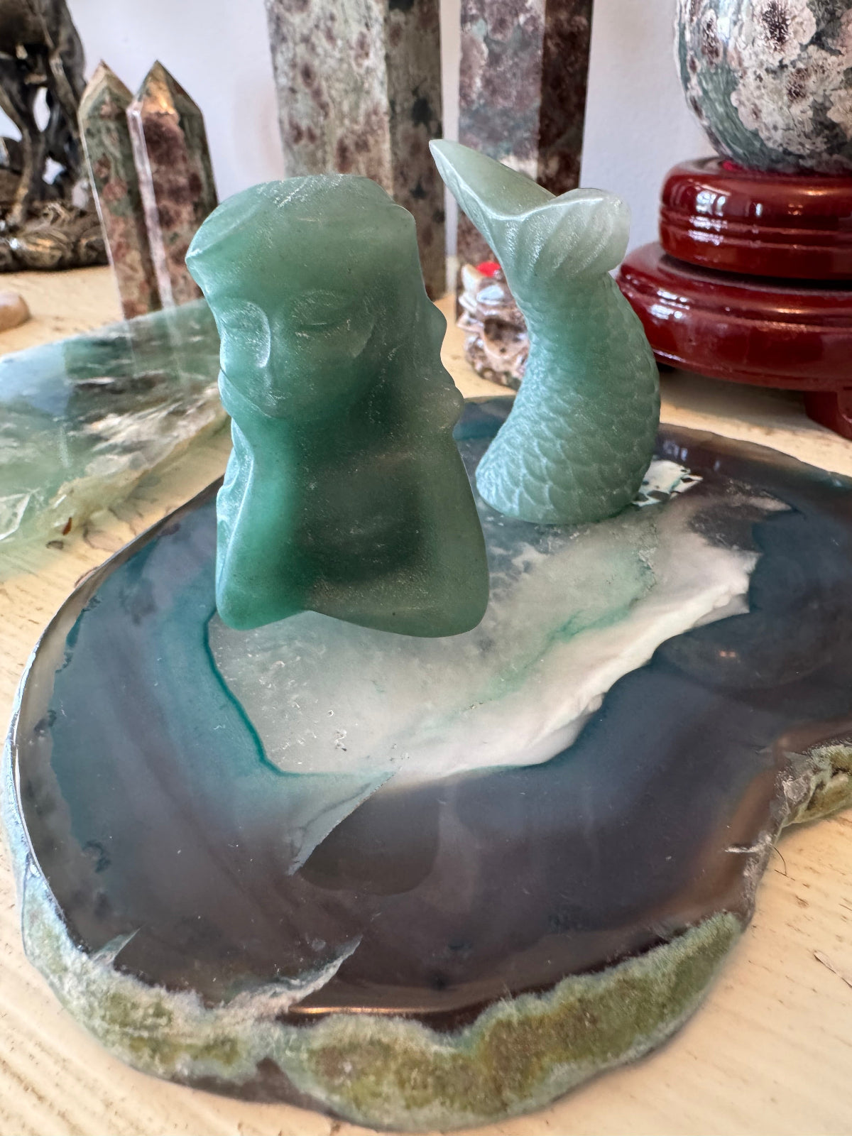 Aquamarine two piece mermaid resting on an agate slab