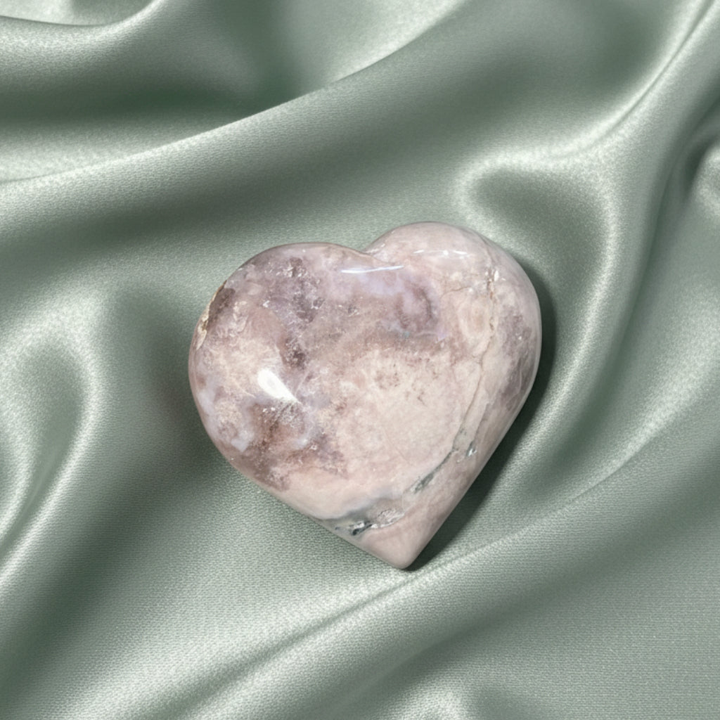 close up flower agate carved heart soft greens, creams and brown colors