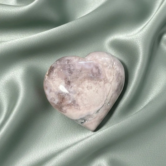 close up flower agate carved heart soft greens, creams and brown colors