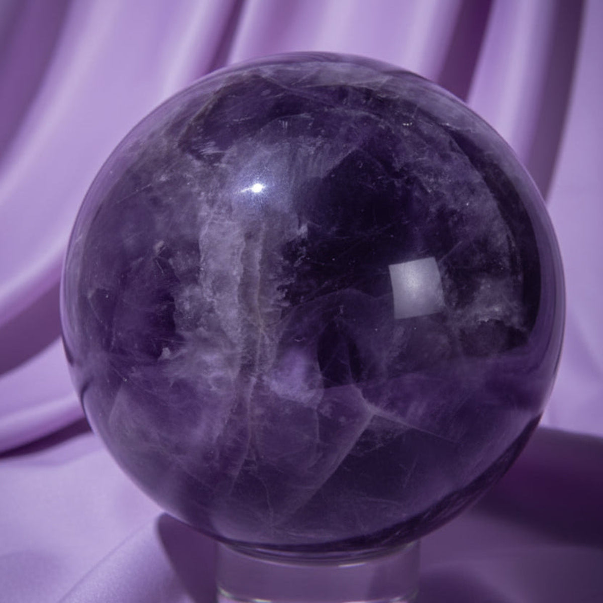 natural purple amethyst sphere purples showing iron inclusions 