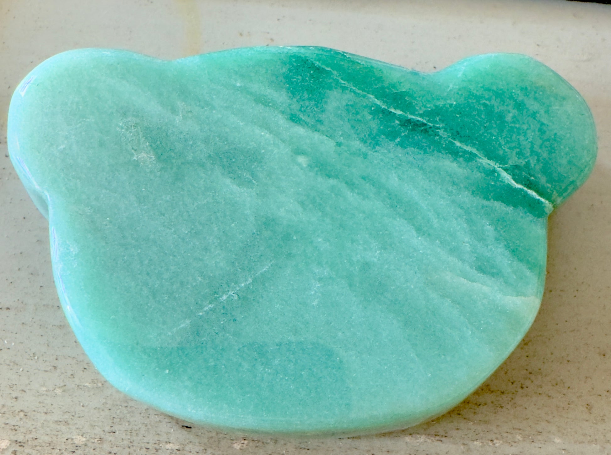 Green bear-shaped gemstone.