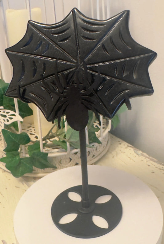 Black Obsidian carved spider web on a black metal spider display stand