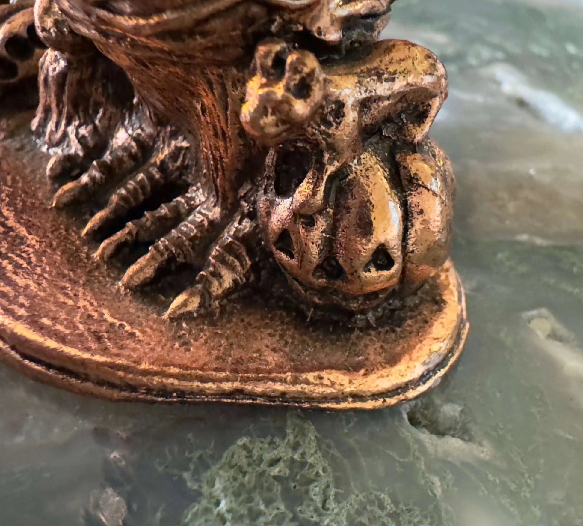Garden Quartz sphere displayed with bronze owl crown stand