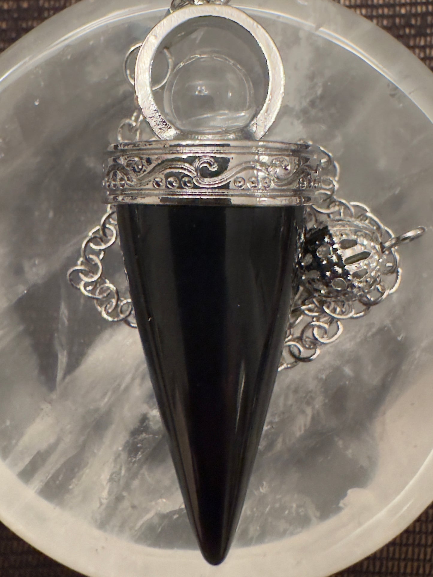Black, silver, cone-shaped pendulum pendant.