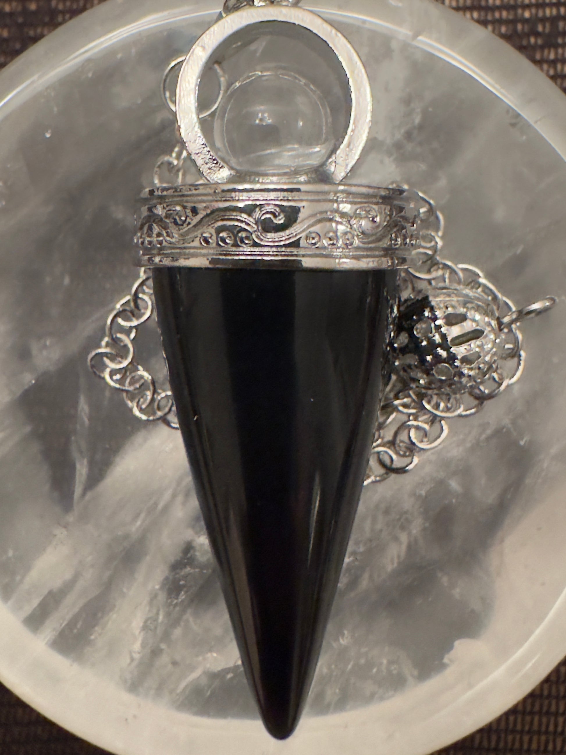 Black, silver, cone-shaped pendulum pendant.