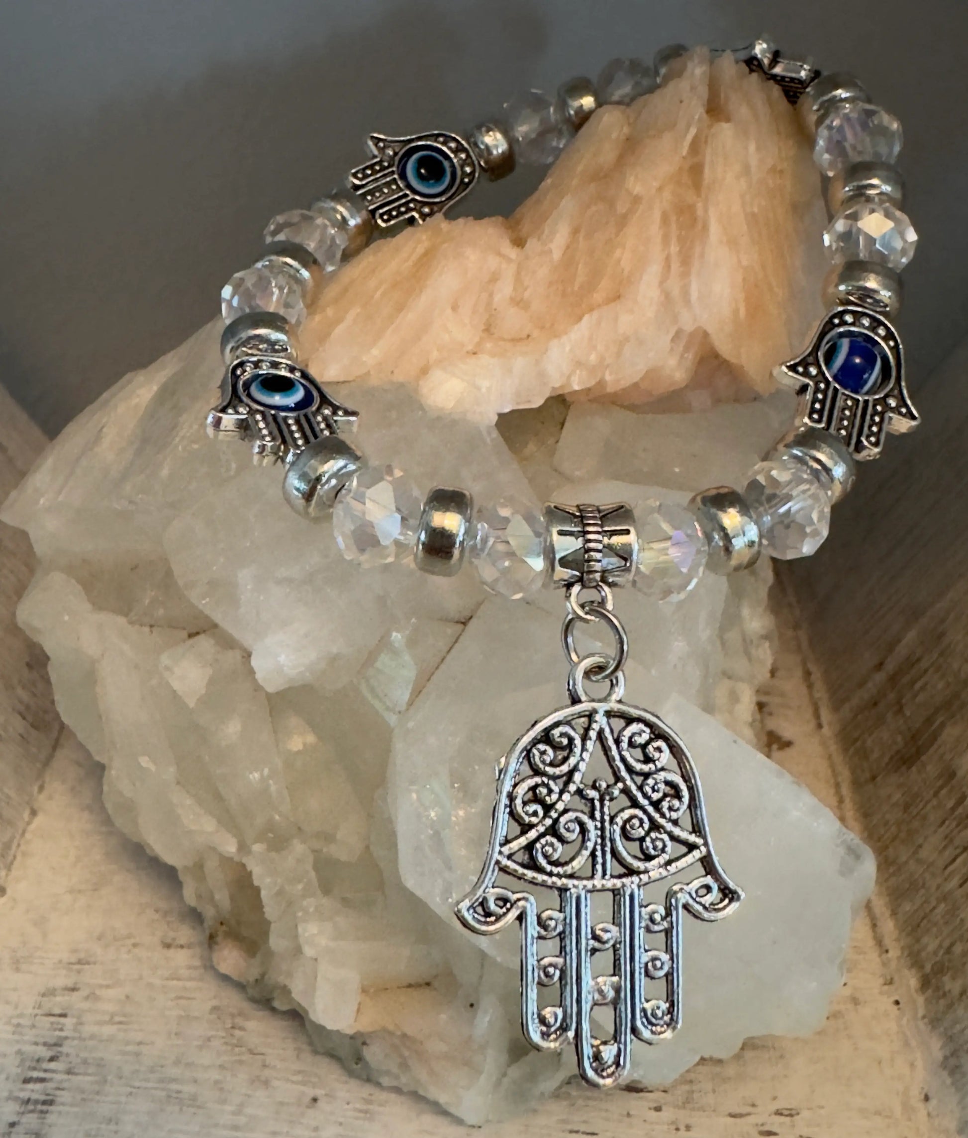 Clear quartz, silver and hamsa hand (some with evil eye spinners), charms Silver filagree hamsa hand.