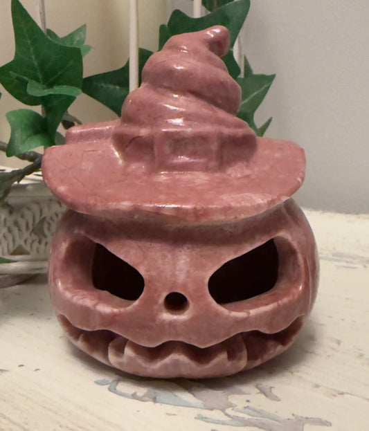 Pink Halloween pumpkin with witch hat.
