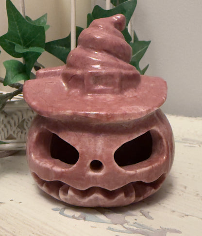 Pink Halloween pumpkin with witch hat.

