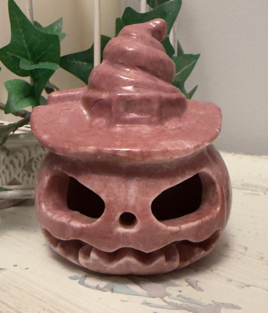 Pink Halloween pumpkin with witch hat.
