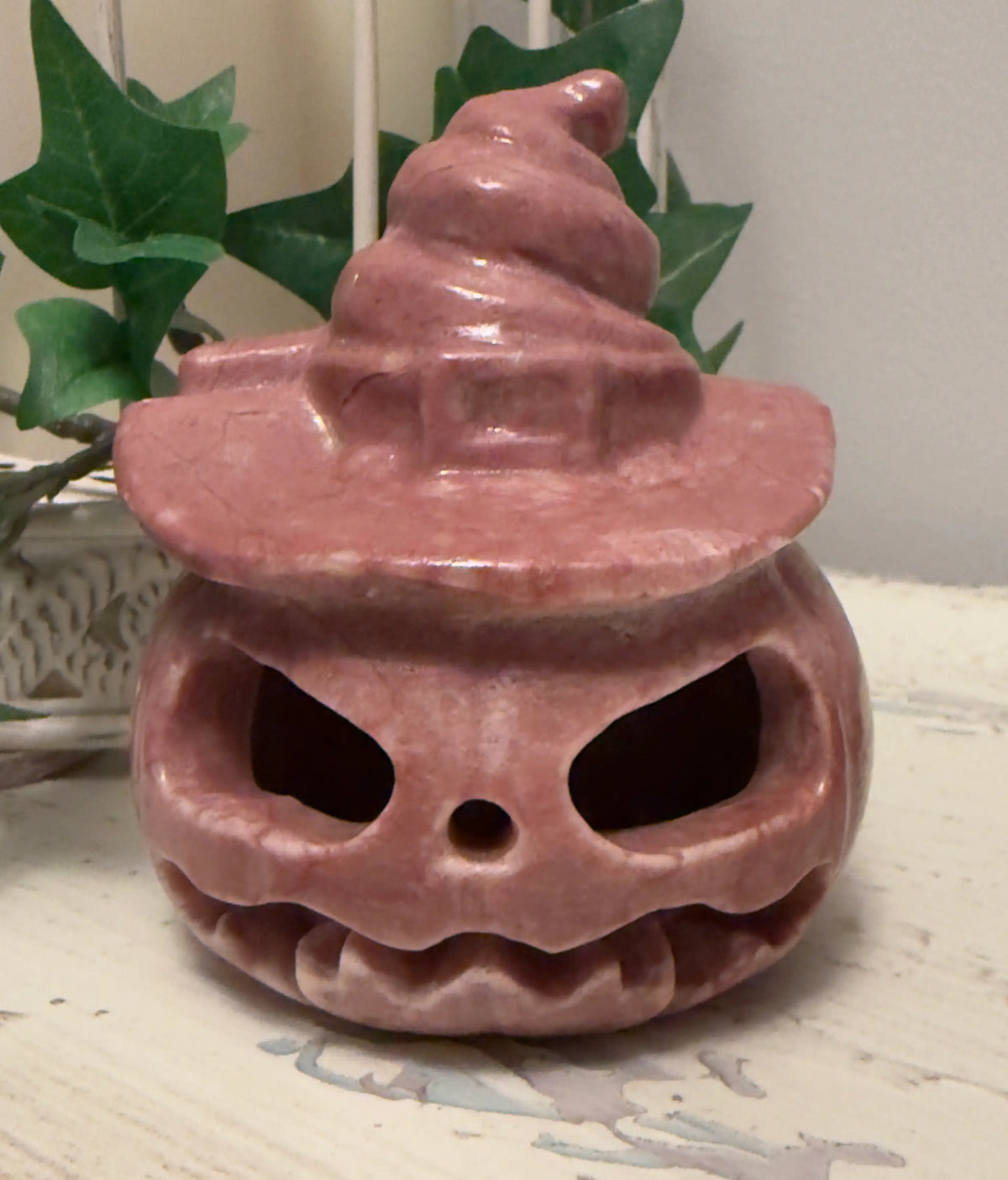 Pink Halloween pumpkin with witch hat.
