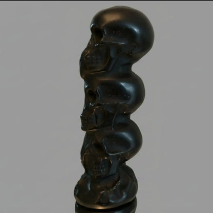 Black Obsidian Three Wise Skulls totem carving close-up
