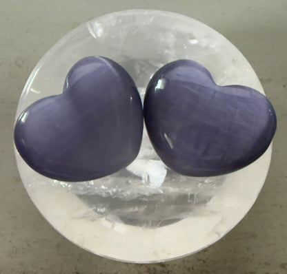 Two lavender chatoyant selenite special cats-eye hearts