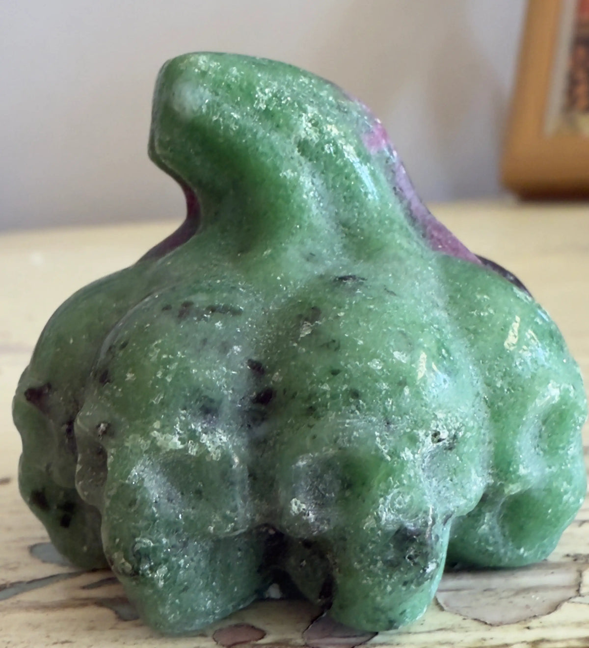 Green and red zoisite gemstone carving.