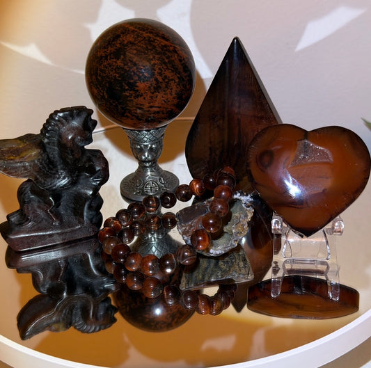 Mahagony Obsidian eight piece collectors set.  Sphere in a brass stand, free form, hand carved pegasus, 8 mm bead elastic band bracelet, lovely geode, carved heart with druzy pocket, acrylic stand