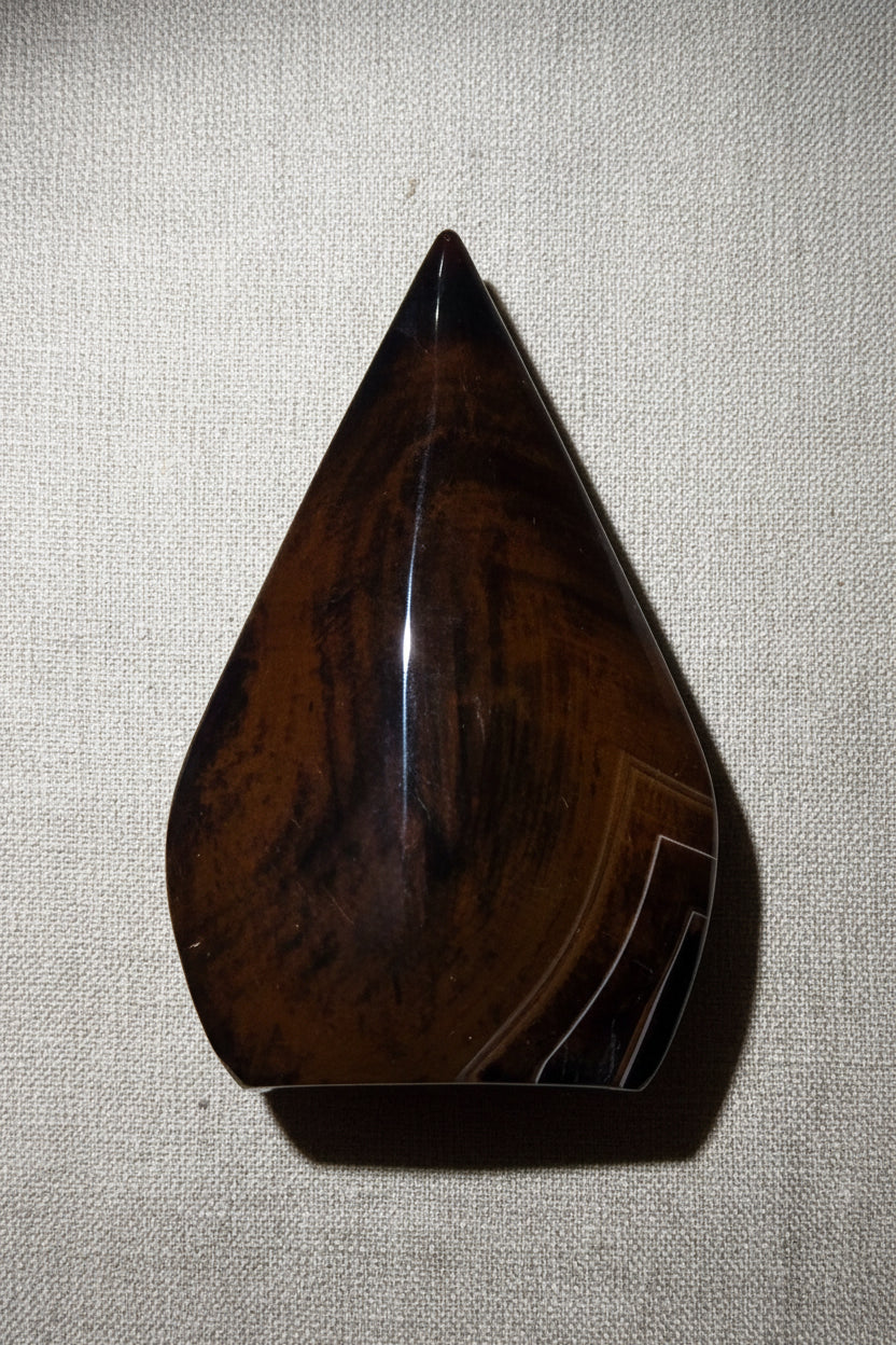 mahogany obsidian free form with natural banding, wood grain appearance