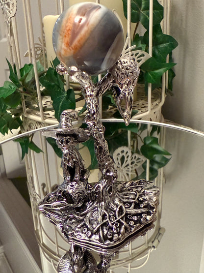 silvery decor crystal sphere stand, cat with witch had standing on a skull and surrounded by mushrooms, 