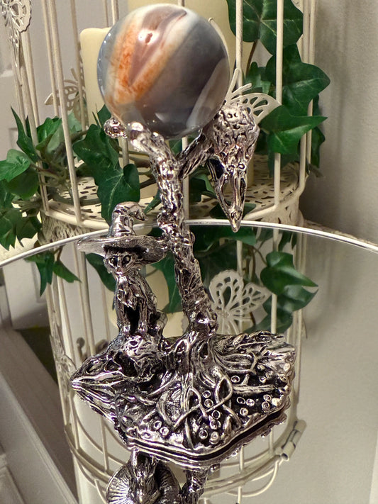 silvery decor crystal sphere stand, cat with witch had standing on a skull and surrounded by mushrooms, 