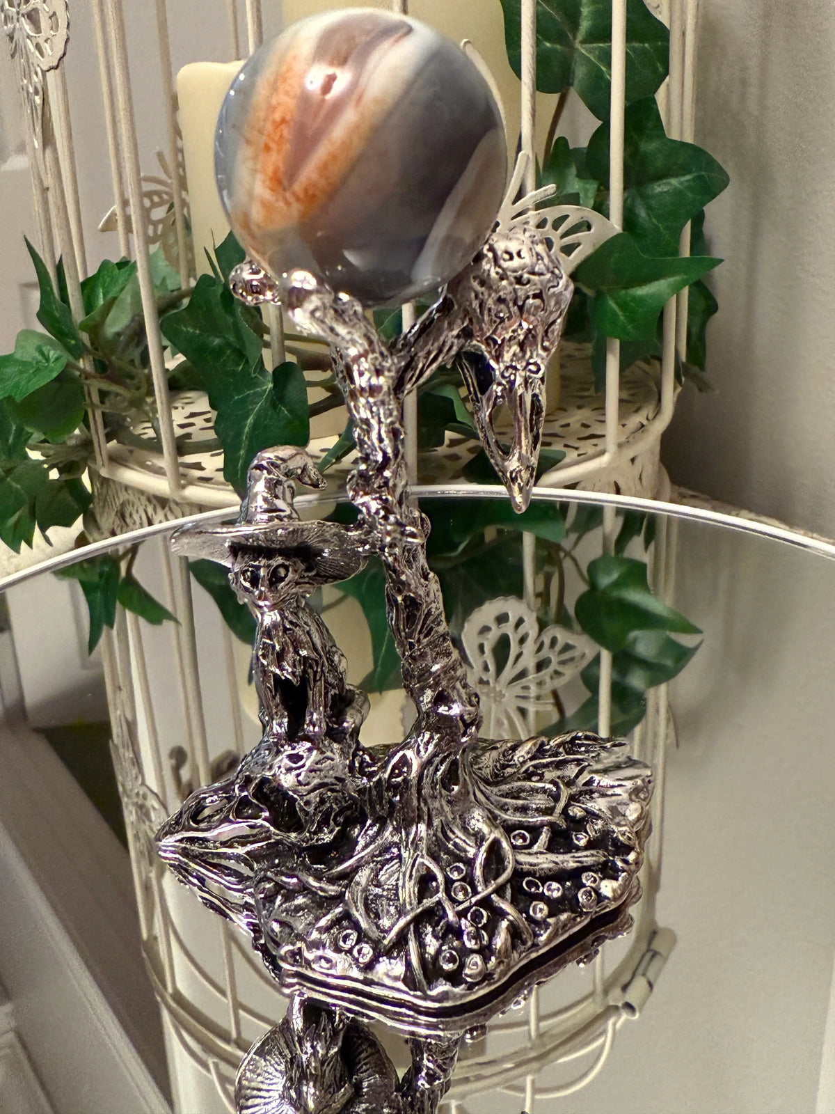 silvery decor crystal sphere stand, cat with witch had standing on a skull and surrounded by mushrooms, 