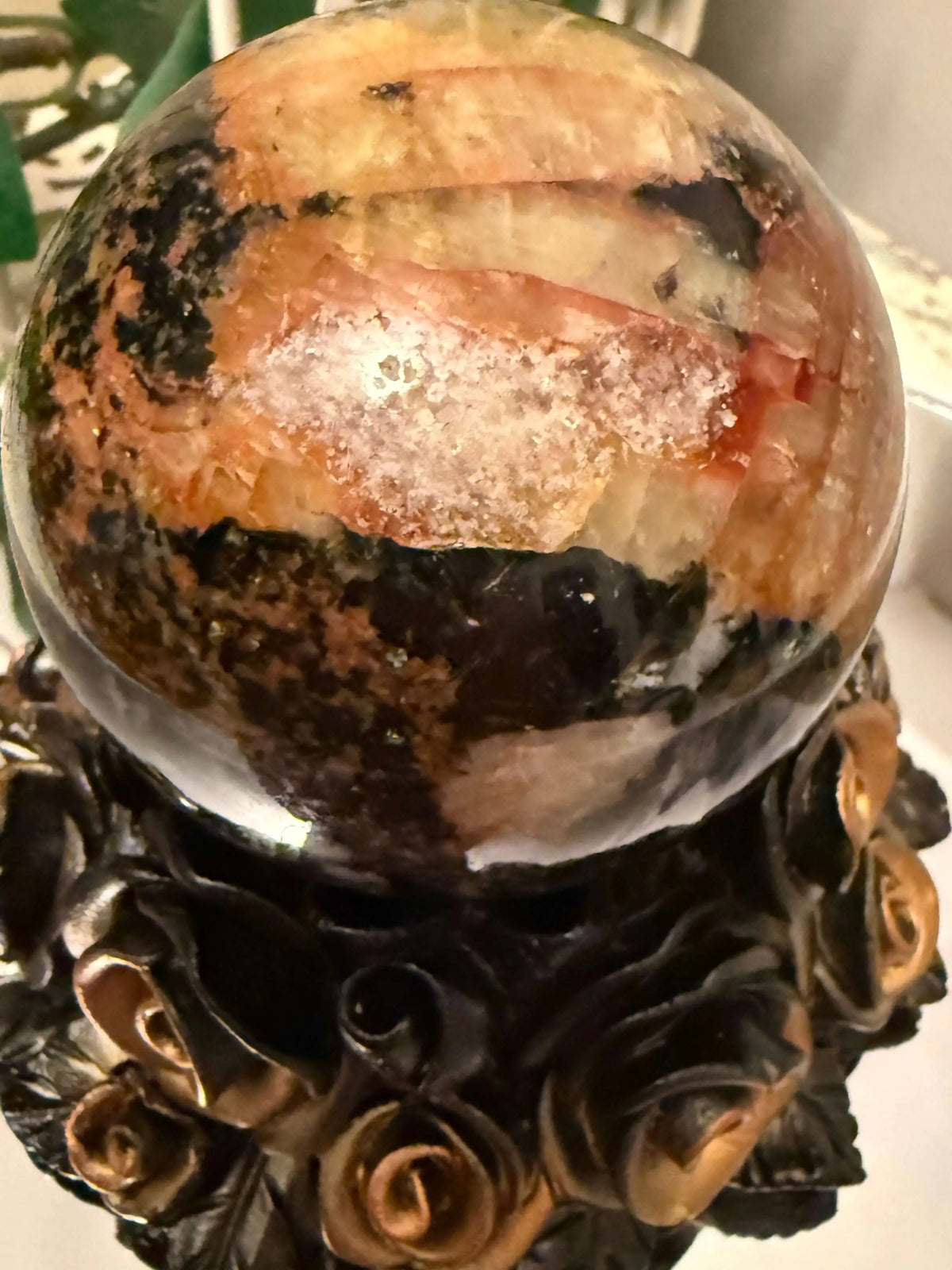 Pietersite crystal sphere on decorative black gold rose stand