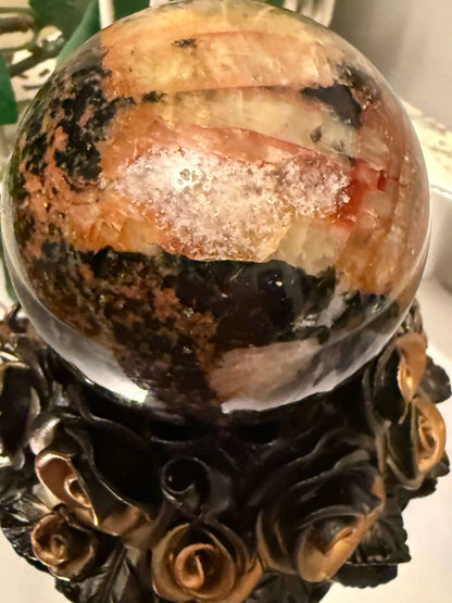 Pietersite crystal sphere on decorative black gold rose stand