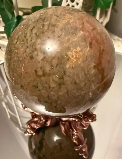 Ocean Jasper sphere on stand with brown green and gold tones
