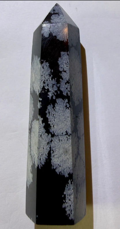 product photo of white and gray six sided snowflake obsidian tower/charger  on a white background