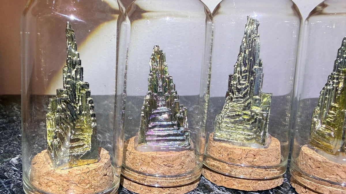 close up mini cloche display with bismuth specimens