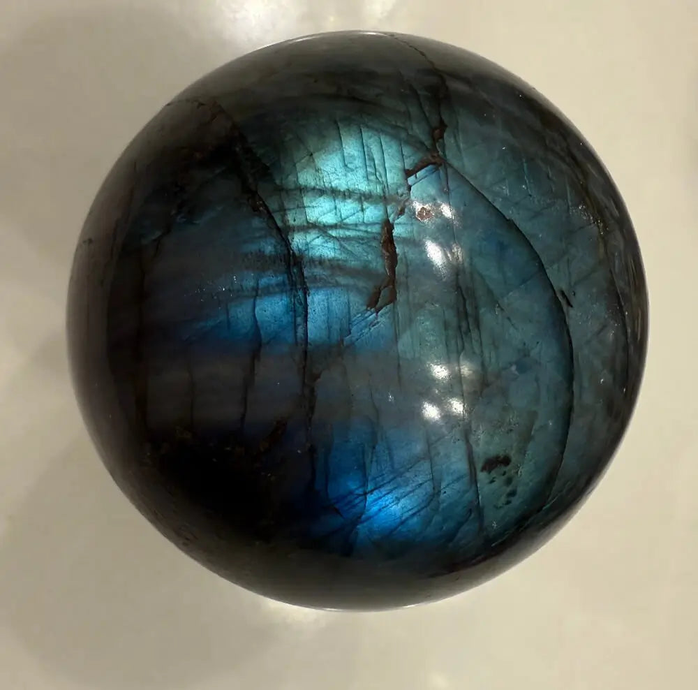 Madagascar Labradorite crystal sphere flash close-up